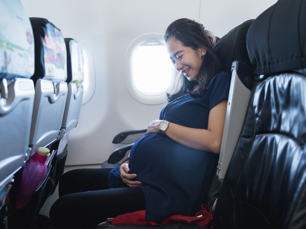 pregnant woman on a plane